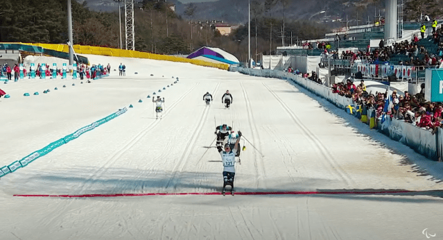 History of the Paralympic Games Thumbnail feat. para cross country skiiers crossing the finish line